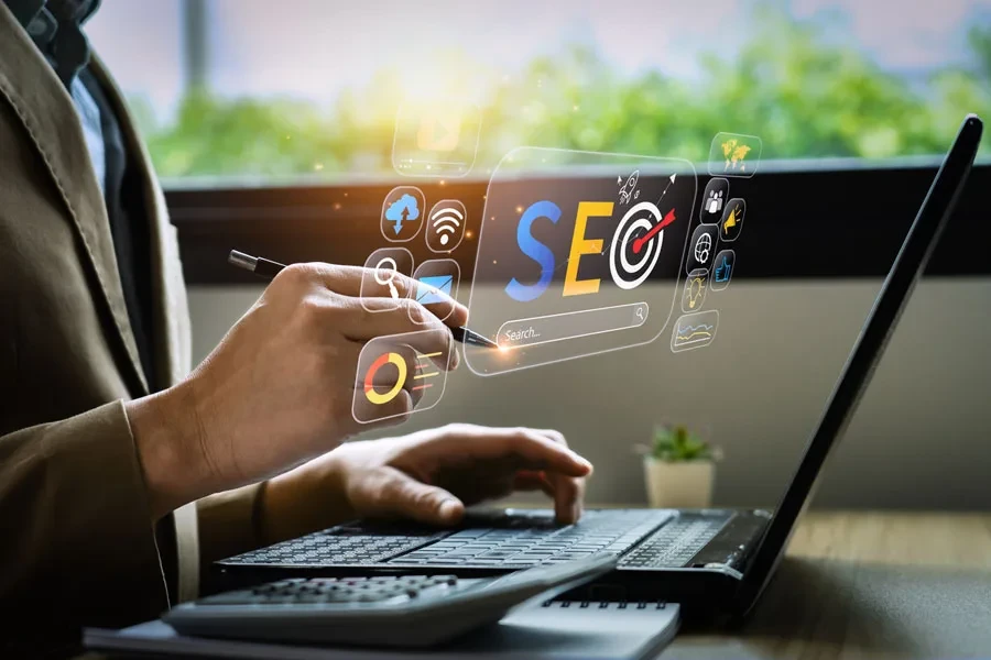 Man-pointing-at-a-virtual-screen-with-the-word-SEO